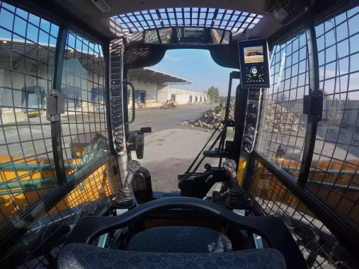 Comfortable CASE skid steer cab - good visibility.